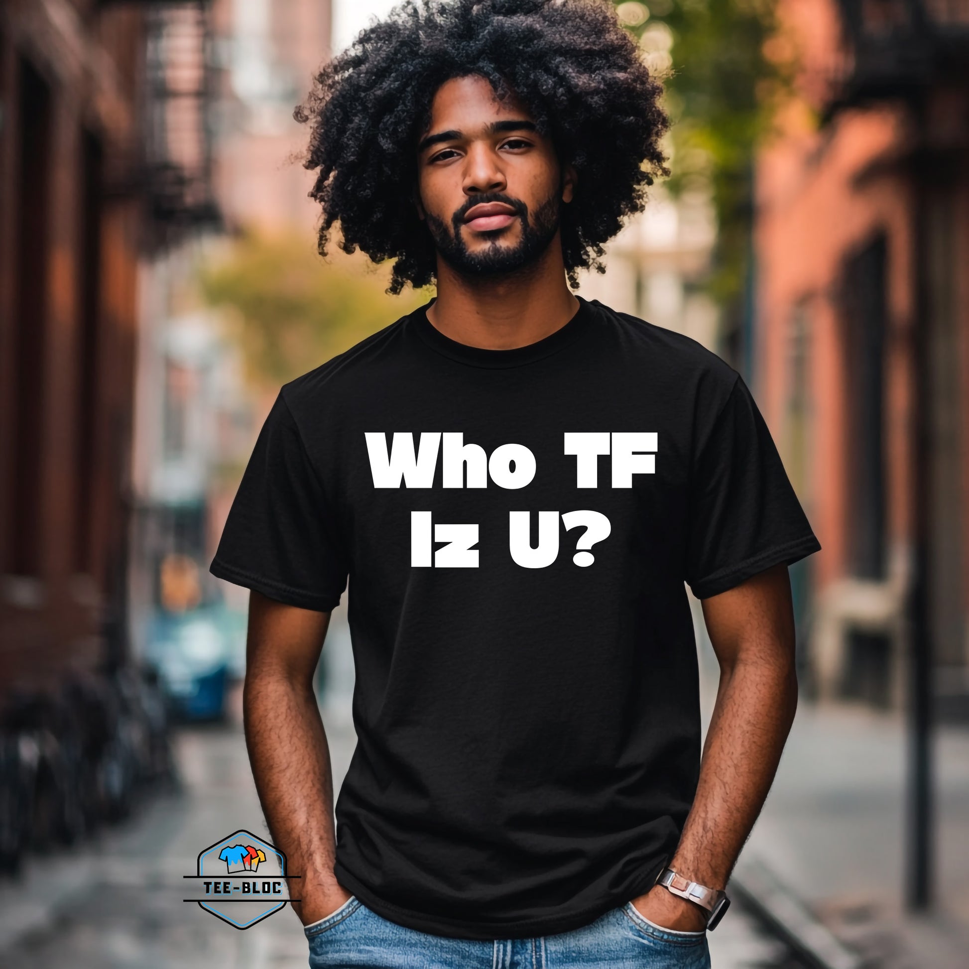 Man wearing a black t-shirt with 'Who TF Iz U?' text on a city street.
