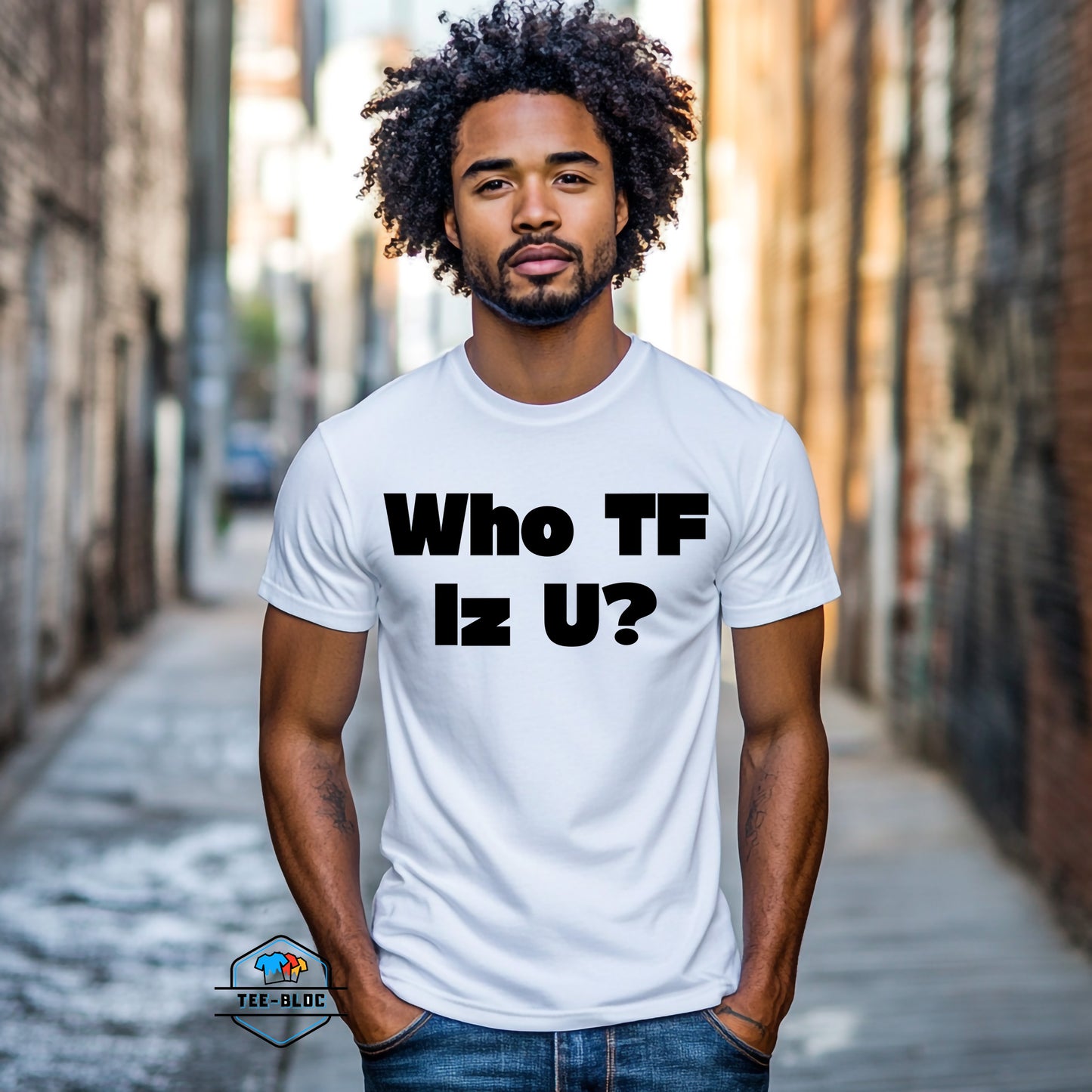 Man wearing a white t-shirt with 'Who TF Iz U?' text in an urban setting