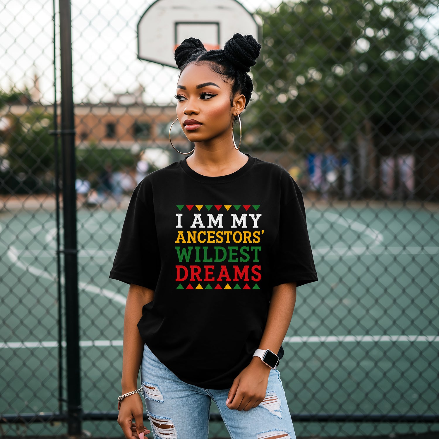 Person wearing a black t-shirt with colorful text on a basketball court