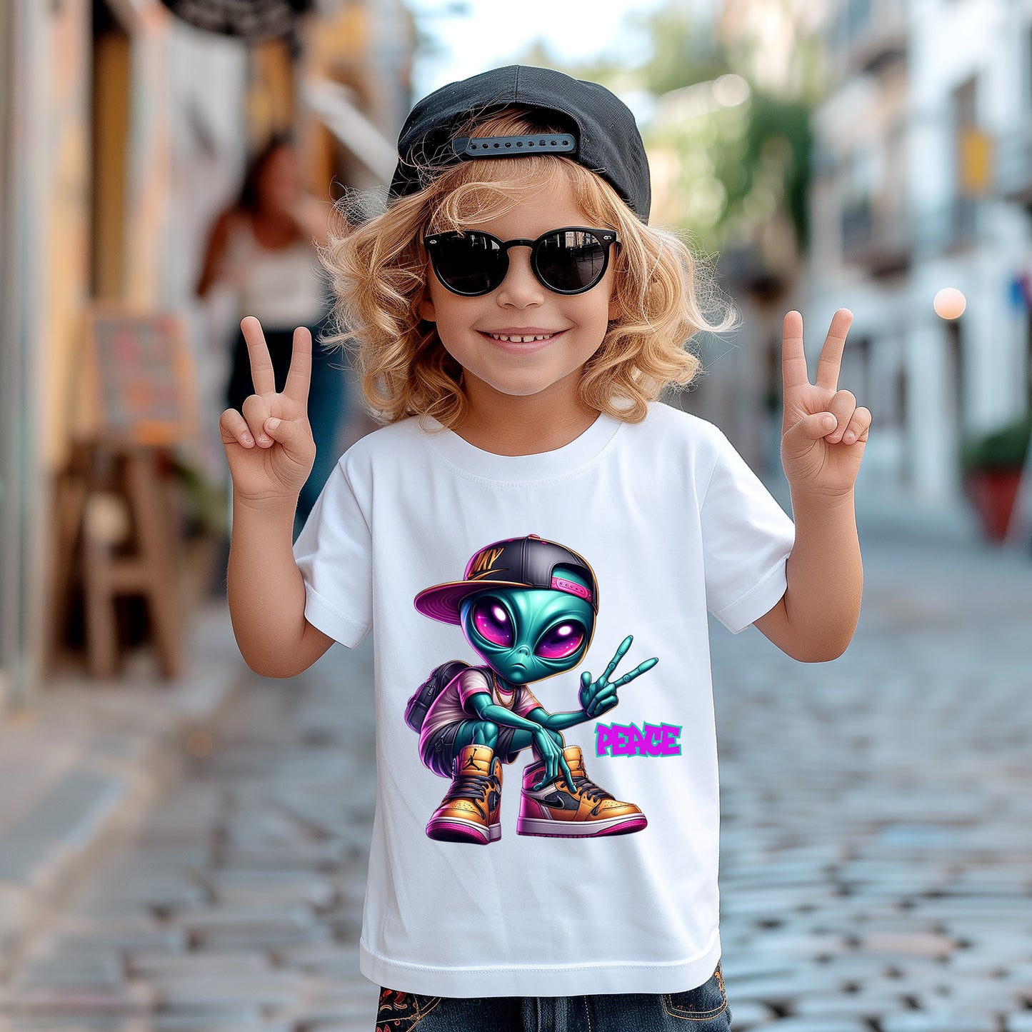 A young kid wearing a cool Peace Out Alien T-Shirts