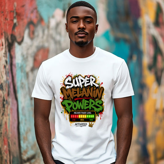 A man wearing a white graphic t-shirt with a colorful 'Super Melanin Powers' design, standing in front of a vibrant, graffiti-covered wall.
